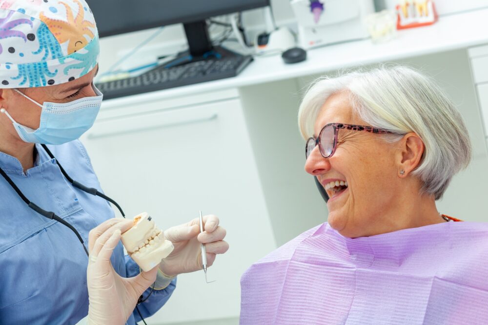 Patient smiling with one missing tooth before dental implant treatment